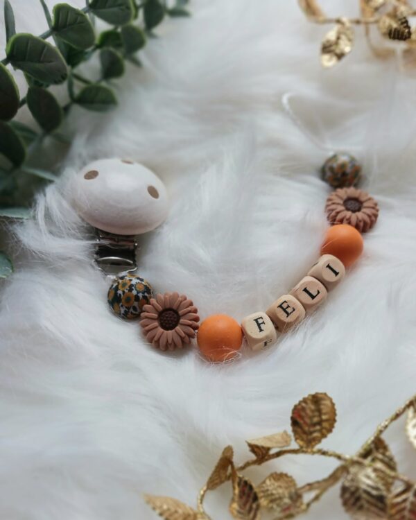 Schnullerkette orange, braun, Blume