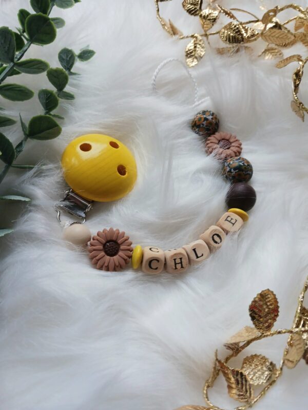 Schnullerkette braun, gelb, Blume